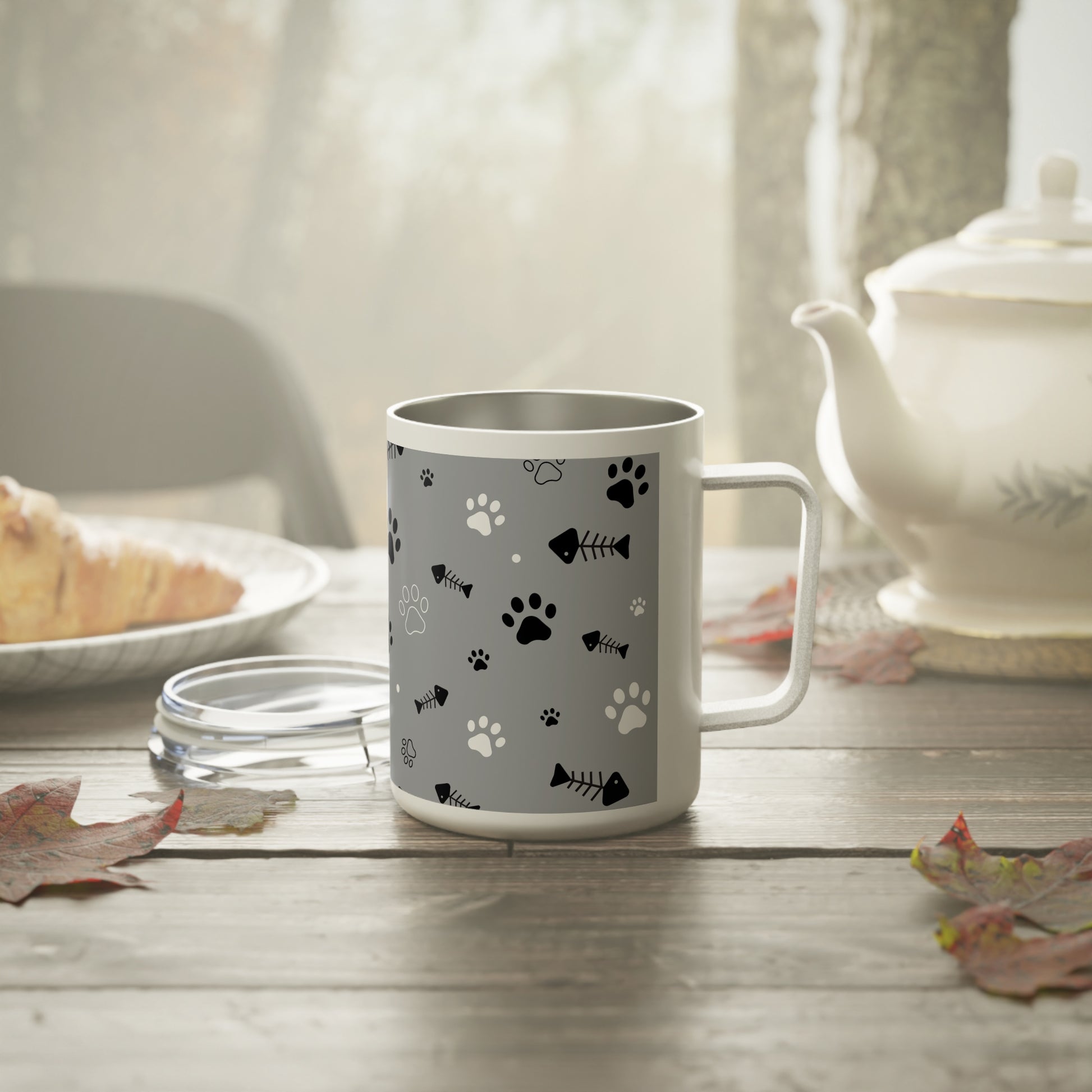 Coffee mug with tiny paw marks and fishbone pattern